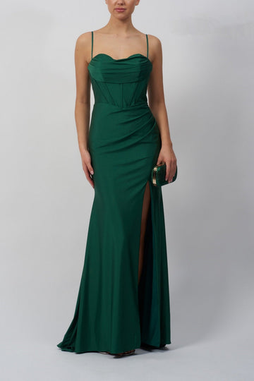 lady wearing a forest green corset top evening dress with high slit