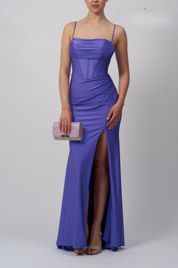 lady wearing a purple corset top evening dress with high slit