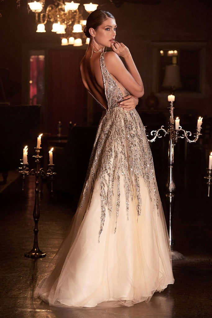 Ladivine Ombre Shimmer Ball Gown C135 with plunging neckline, open back, and glittering bead embellishments in a candlelit ballroom setting.