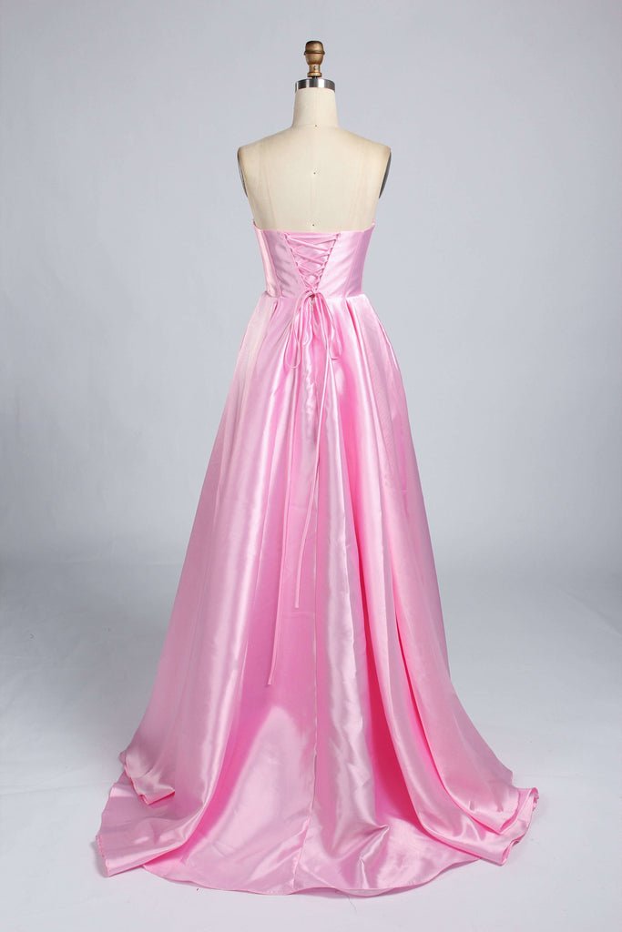 Back view of pink satin ballgown prom dress featuring lace-up corset closure and flowing train, combining glamour with adjustable fit.