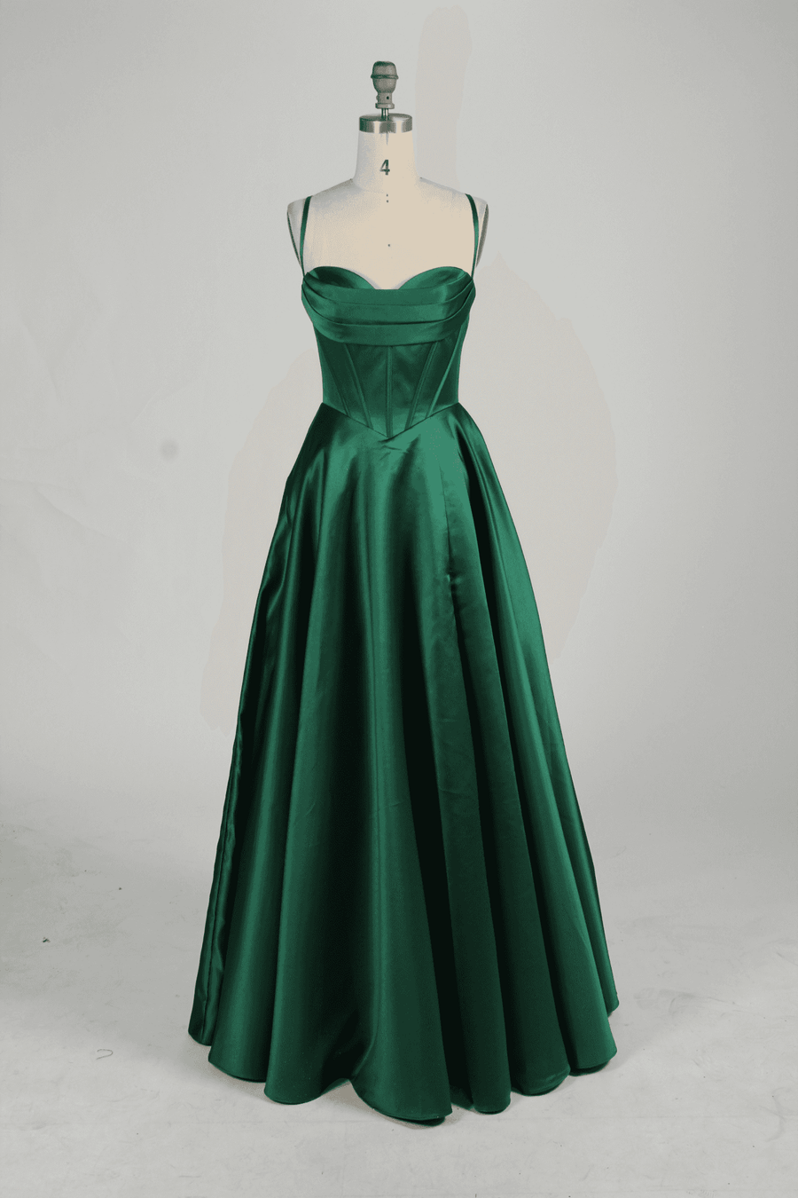 Keira emerald green satin ballgown with sweetheart neckline, corset bodice, and full-length skirt for prom or evening wear.