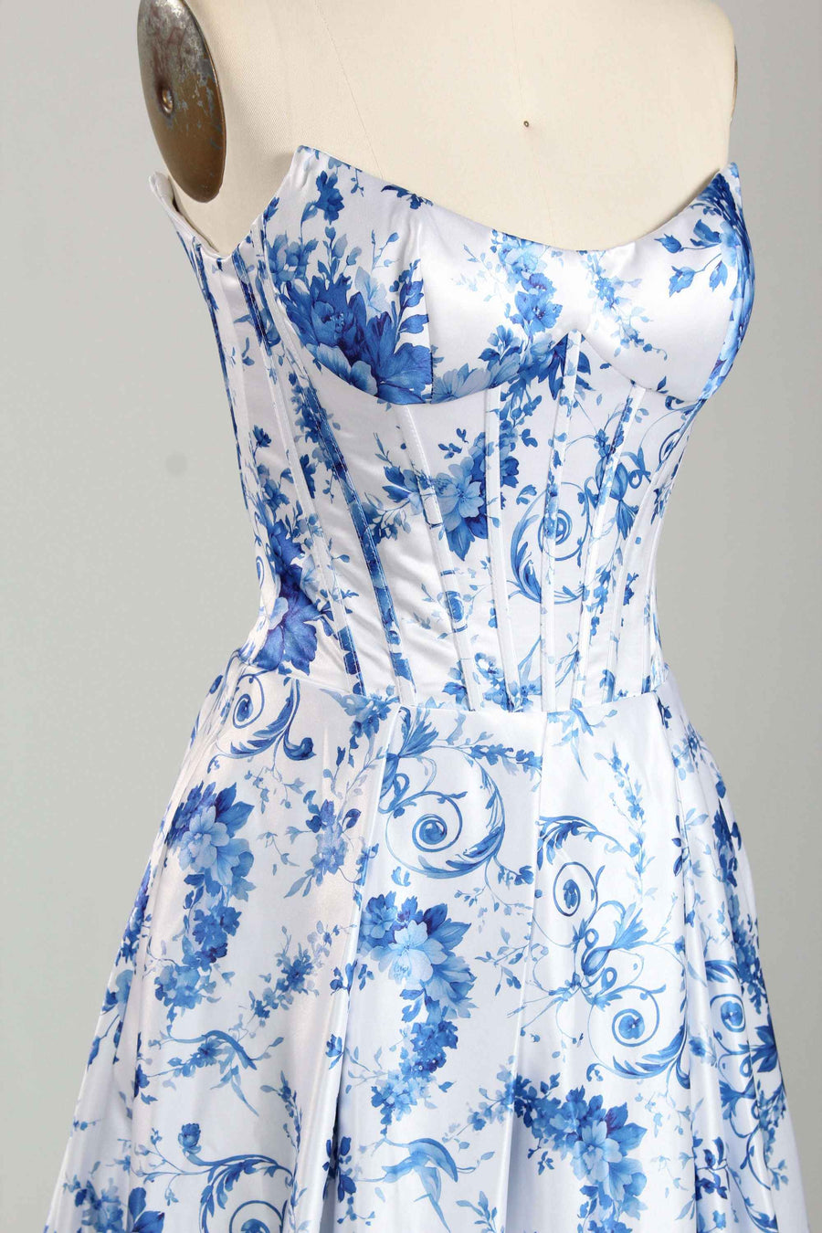 Close-up of Jessica Stuart Darcet Floral Prom Gown bodice with blue floral print and boned corset structure for a flattering fit.
