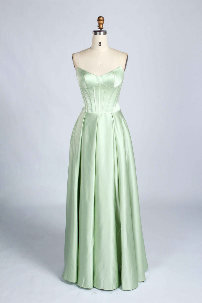 Front view of sage green Jessica Stuart Darcet Prom Gown with strapless boned bodice and pleated satin skirt.
