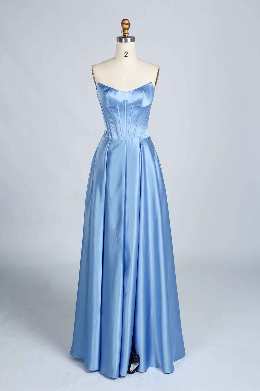Front view of dusty blue Jessica Stuart Darcet Prom Gown with structured strapless bodice and flowing satin skirt.
