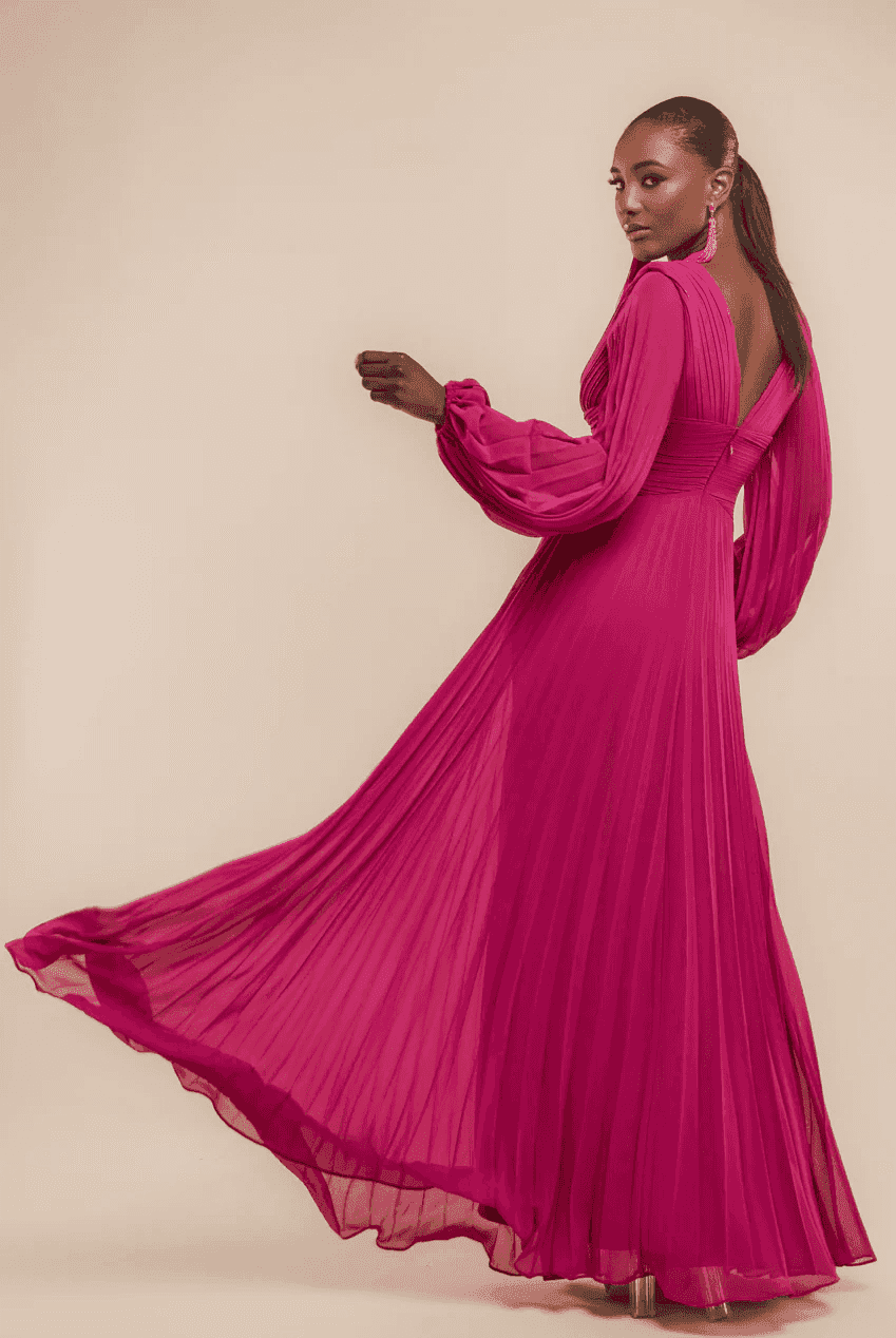 Goddiva Chiffon Maxi Dress in Pink with pleated skirt and balloon sleeves, ideal for bridesmaids and evening events. Elegant V-neck design in blush pink.