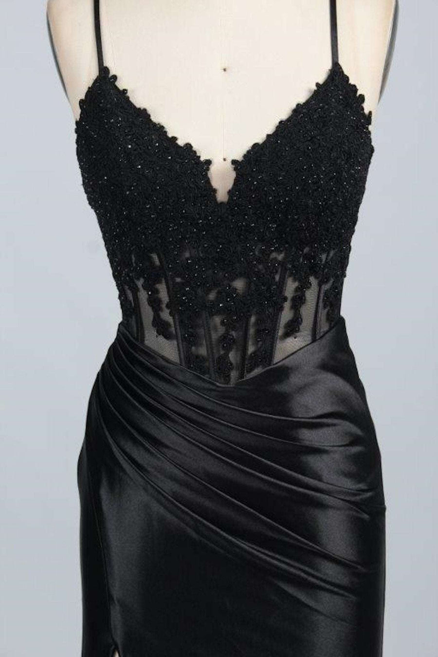 Jessica Stuart Blake Black Corset Satin Prom Dress featuring an embellished corset bodice, sheer paneling, and ruched satin skirt with leg slit.
