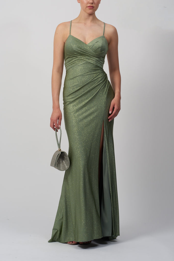 young model in a tight fitting light green prom dress