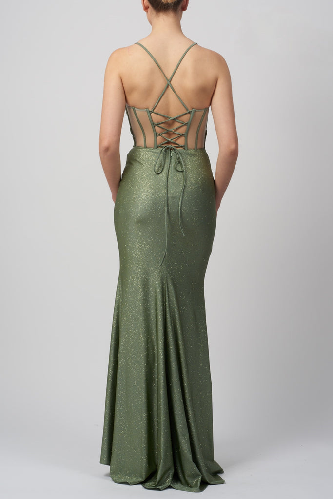 back view of a lady wearing a corset back evening gown in green