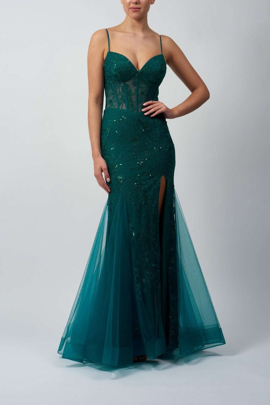 model in green mermaid corset dress by mascara london