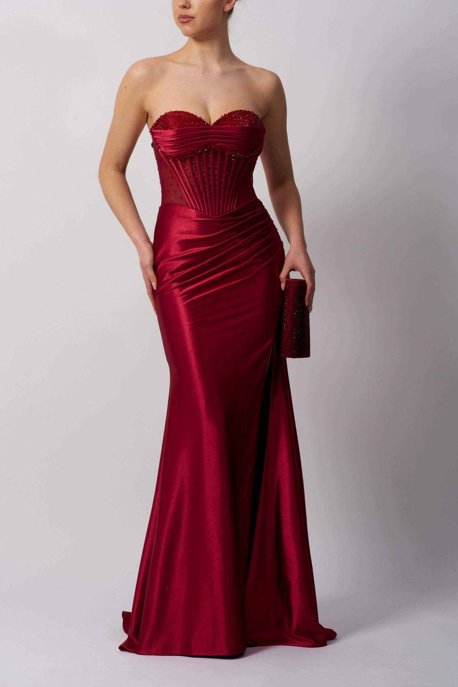 Mascara MC113423 BEADED BUST strapless red prom gown featuring beaded bust, structured corset waist, ruched satin skirt, and thigh-high slit.
