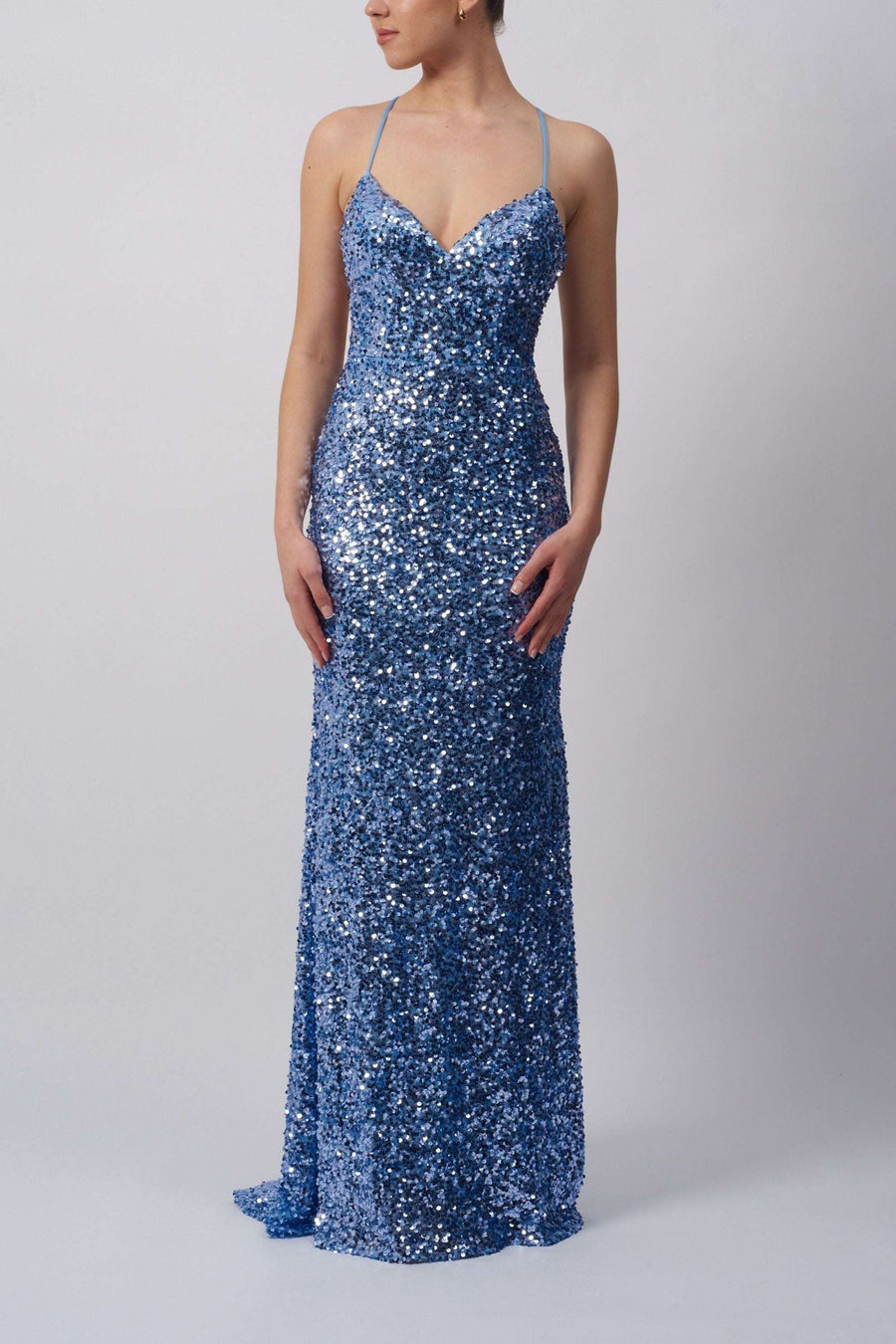 Powder blue sequin dress by Mascara London featuring a tie back and full-length fit. Ideal for prom or red carpet events with shimmering detail.