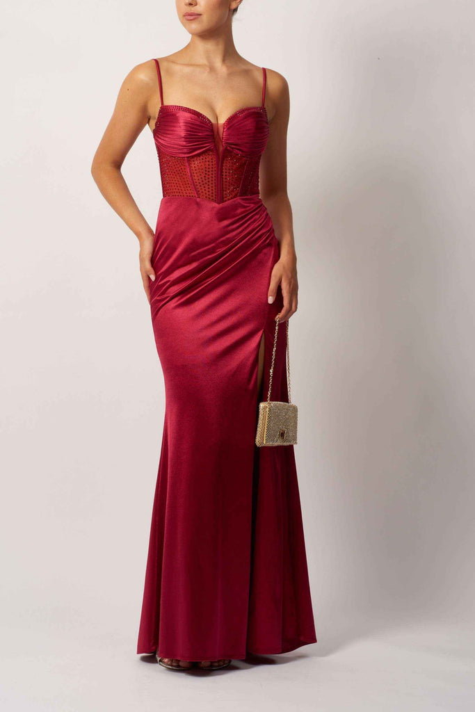 Mascara MC11434 HOT FIX Jersey corset long satin gown in deep red with beaded bodice and ruched skirt, ideal for prom or red carpet events.