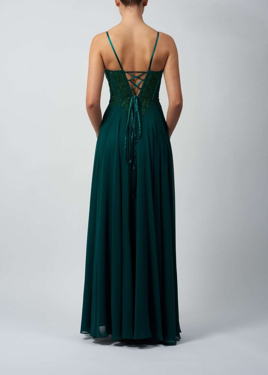 Mascara London MC119321 Gown in wine chiffon shown from the back with lace-up tie detail and flowing skirt, ideal for bridesmaids or prom.