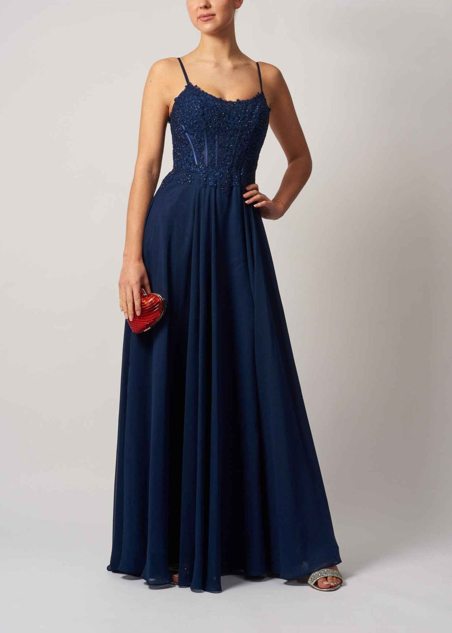 Mascara London Navy Chiffon Gown MC119321 with beaded bodice and flowing skirt, ideal for prom or bridesmaids. Elegant formal dress with tie-up back.