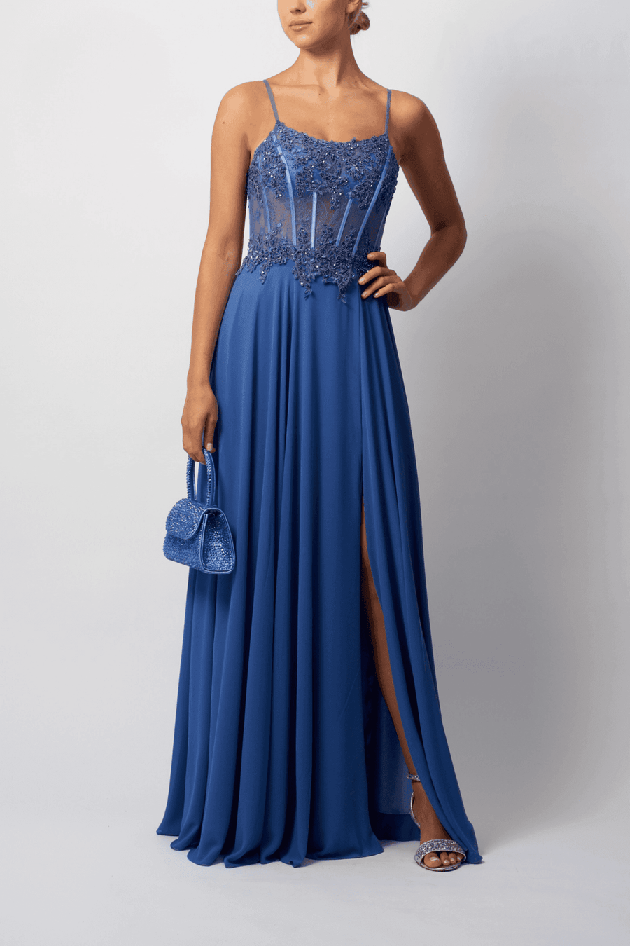 London Chambray Gown by Mascara features embellished bodice and flowing chiffon skirt, ideal for bridesmaids, proms, or formal evening events.