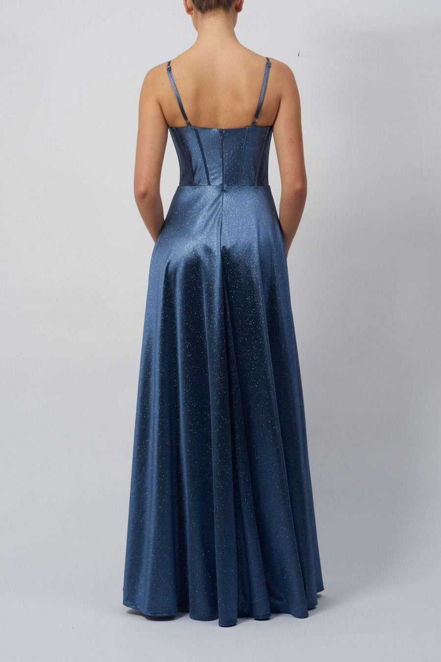 Back view of Mascara London Storm Blue MC12338 Boned Drape Satin Ballgown showing structured corset seams and flowing satin skirt.