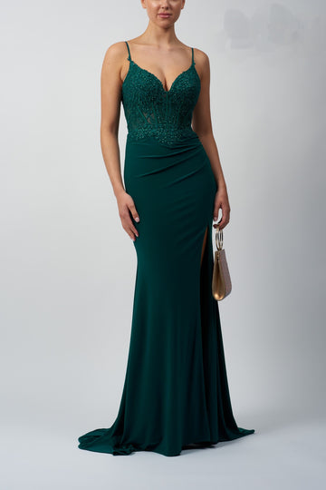 model in corset fitted gown green