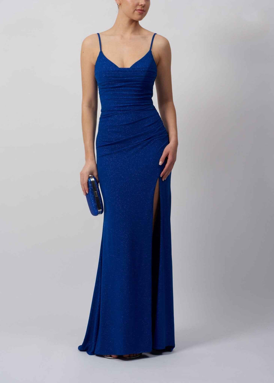 Image of a lady in a slim fitting royal blue glitter long dress