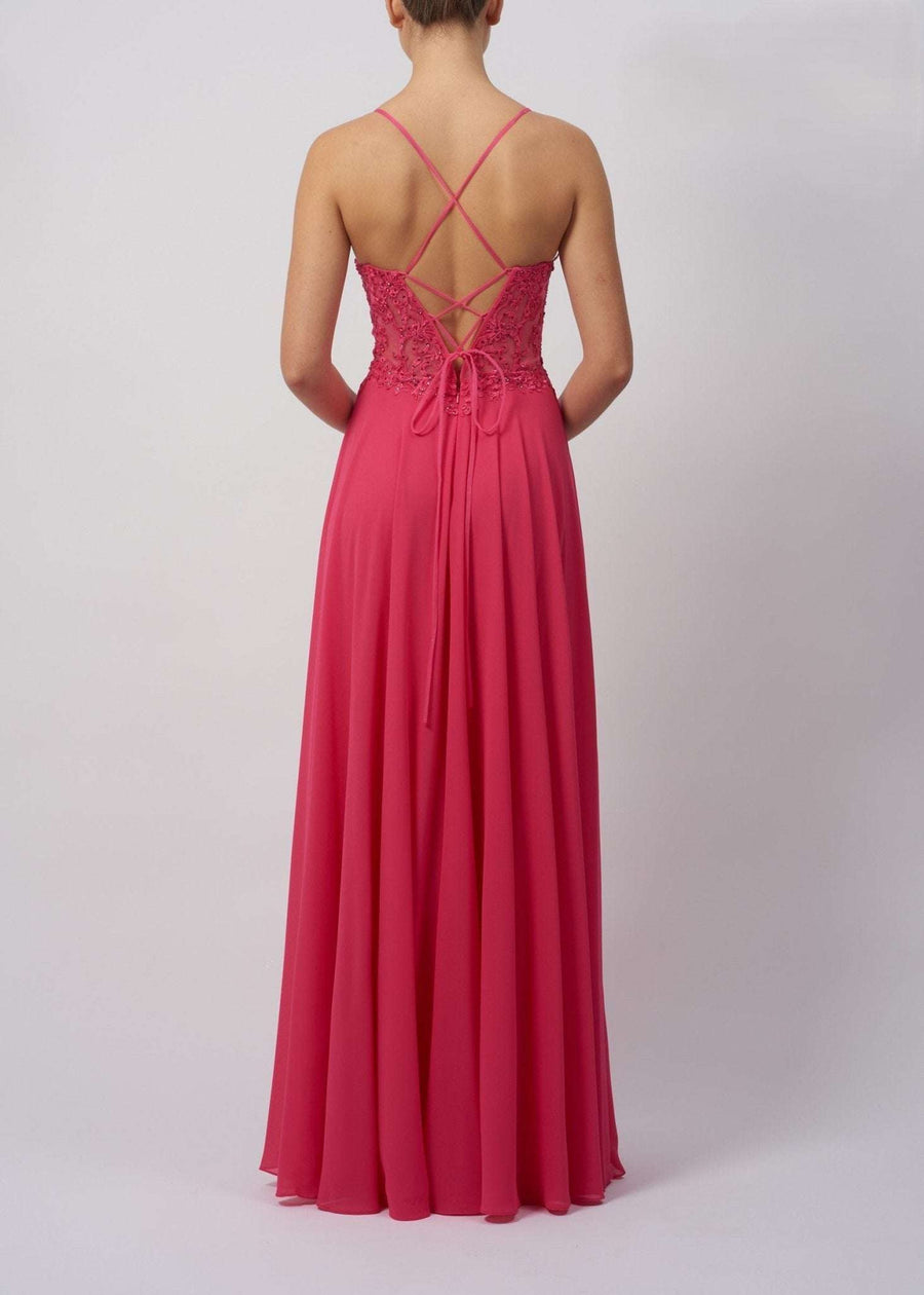 Back view of Mascara MC29333 chiffon bridesmaid dress in pink, featuring crisscross tie back and flowing full-length skirt.