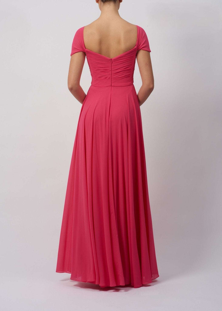 Back view of Navy MC29338 Chiffon Dress with pleated front and cap sleeves, showcasing elegant flow and flattering fit for formal occasions.