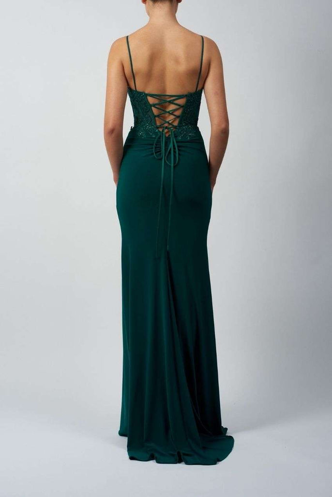 Back view of Mascara MC18328 prom dress in green, featuring lace-up tie back and flowing jersey fabric. Stylish choice for proms or events.