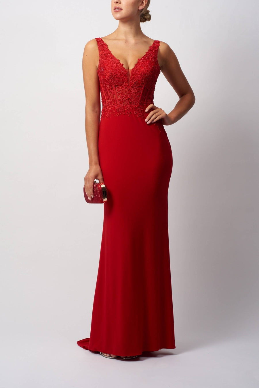 Red evening gown with lace detailing on a white background