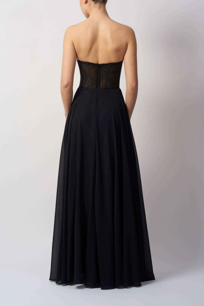 Back view of black lace chiffon corset dress showcasing strapless design and elegant full-length chiffon skirt.