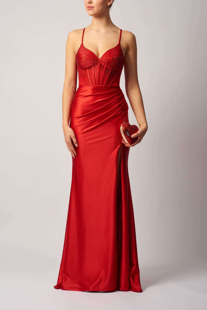Satin evening dress in vibrant red with beaded bodice, fitted silhouette, and thigh-high slit, perfect for prom or formal occasions.