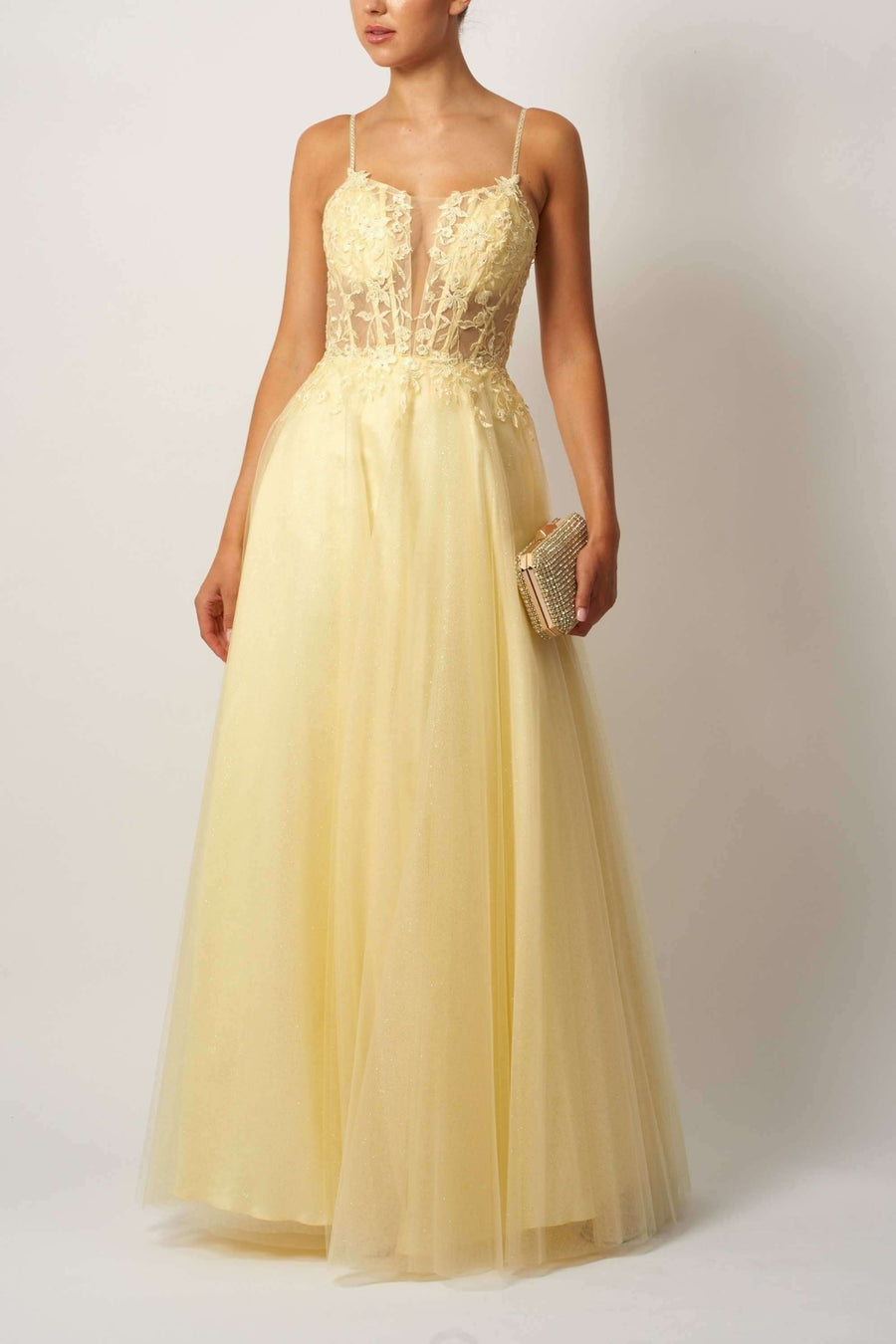 Yellow Tulle Glitter Ballgown MC119511 featuring a sheer lace bodice, spaghetti straps, and full tulle skirt. Ideal for prom or red carpet events.