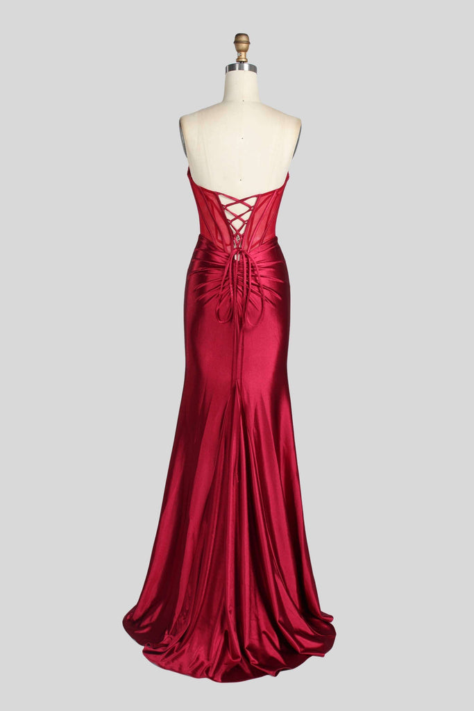 Back of Jessica Stuart Annabelle Satin Gown on mannequin showing lace-up corset and flowing mermaid train in rich wine satin for formal occasions.