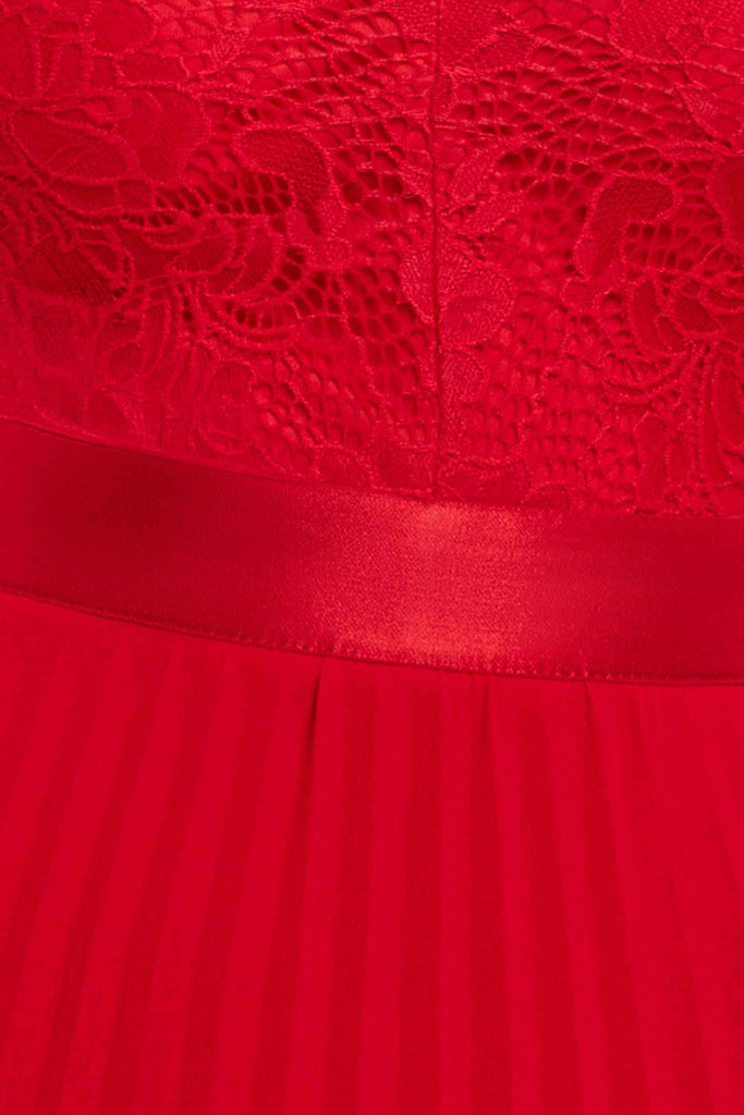 Close-up of Scalloped Lace Maxi Dress in red, showing intricate lace bodice and pleated chiffon A-line skirt with satin waistband detail.