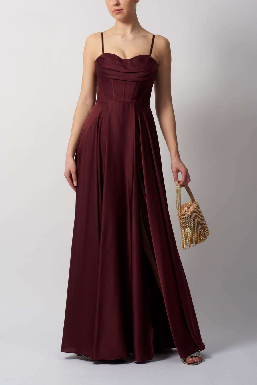 Burgundy satin corset prom dress with spaghetti straps and high leg split, perfect for formal events and special occasions in chic Airforce style.
