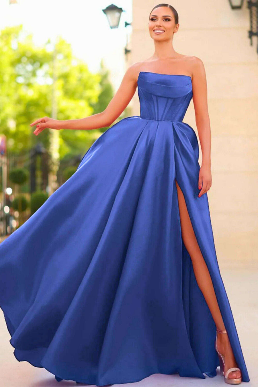 Carmen Royal Blue Long Satin Ball Gown with Pockets featuring a strapless neckline, structured bodice, and thigh-high slit, ideal for prom or red carpet events.