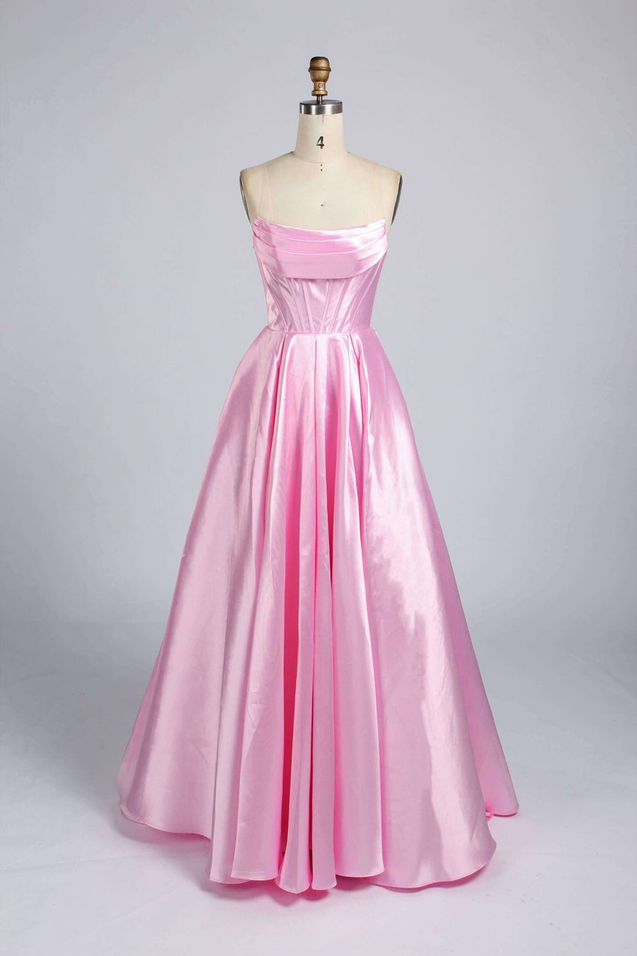 Carmen Satin Gown with Pockets in elegant pink satin featuring a strapless neckline, A-line silhouette, and floor-length design for formal events.