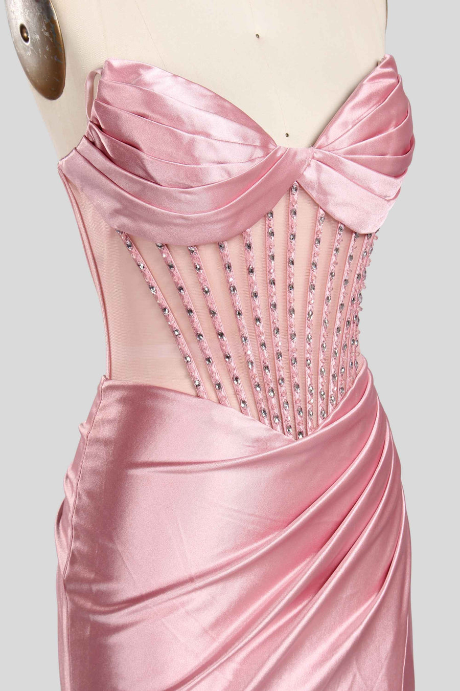 Annabelle Strapless Gown in pink satin with sweetheart neckline, sheer crystal-embellished bodice, and ruched mermaid silhouette for weddings.
