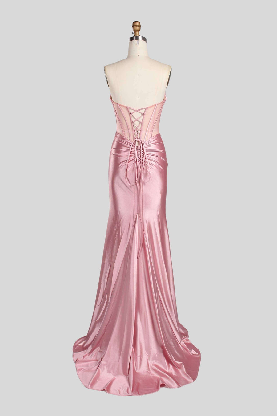 Back view of Annabelle Strapless Gown in pink satin with lace-up corset and mermaid silhouette, ideal for weddings or black tie galas.