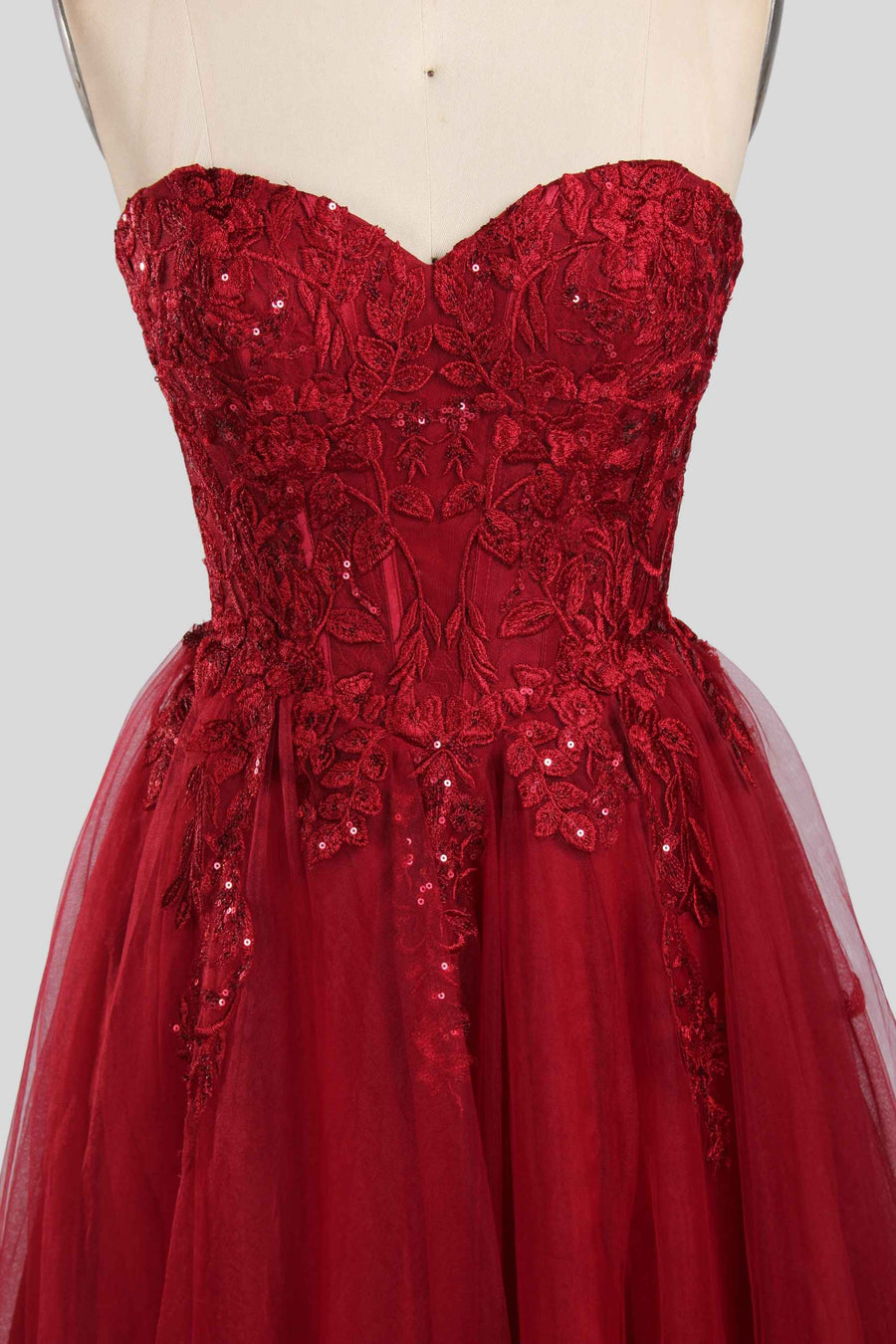 Jessica Stuart Luna strapless sequin ballgown in wine red with embroidered lace bodice and flowing tulle skirt, ideal for prom or evening wear.