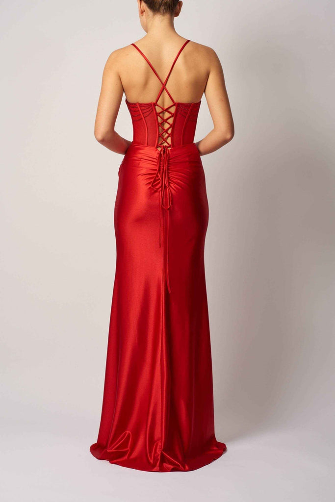 Back view of red satin fitted evening dress featuring lace-up corset detail and ruched waist, ideal for elegant special events.