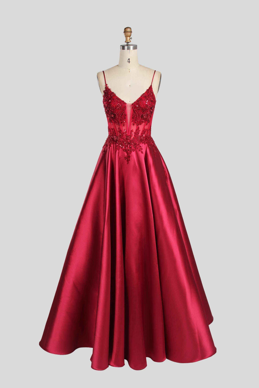 Lace Bodice Satin Evening Gown – Portia Collection in deep red with spaghetti straps, sequin embellishments, and a flowing A-line skirt.