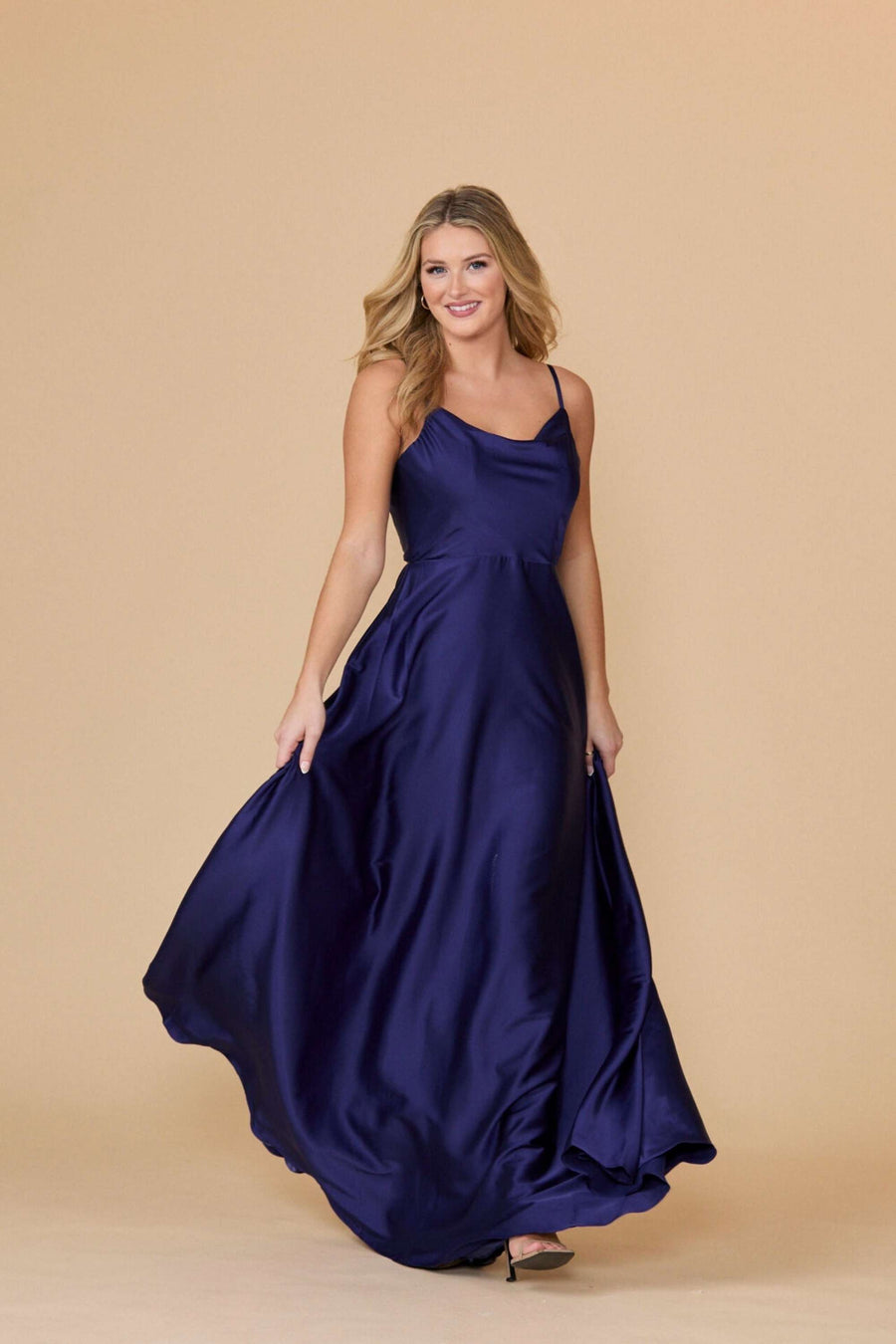 Elegant navy satin prom dress with a flared skirt and cowl neckline. Ideal for bridesmaids, parties, or formal evening wear.