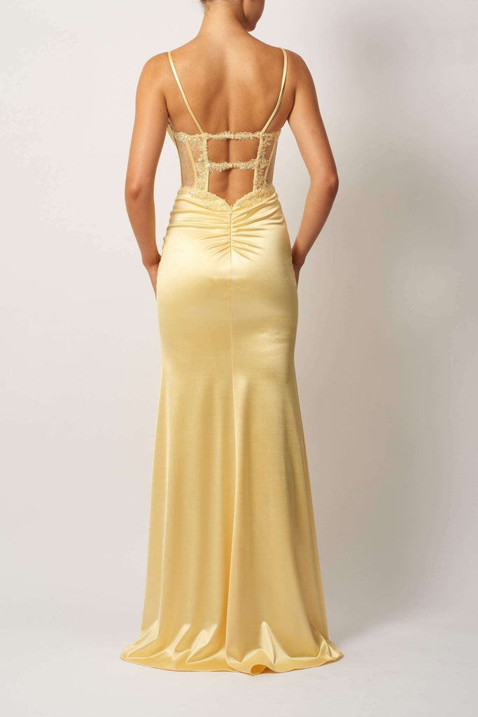 Back view of Mascara MC11522 lemon pleated bust jersey dress with lace-up detail and ruched back, perfect for bridesmaids or formal occasions.
