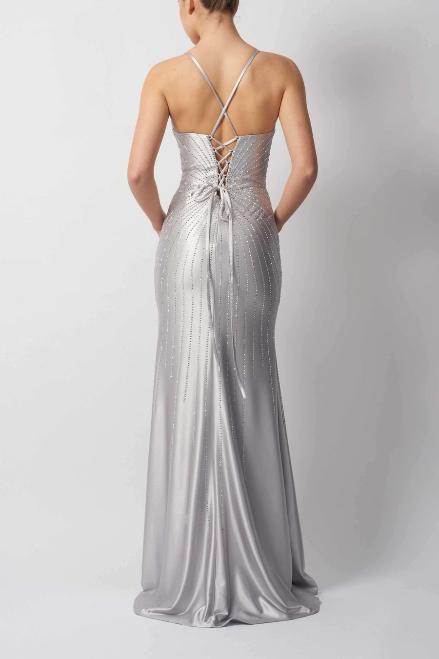 Back view of MC12511 Silver Satin Prom Dress - Diamonte featuring lace-up corset detail and radiant diamonte accents by Mascara London.