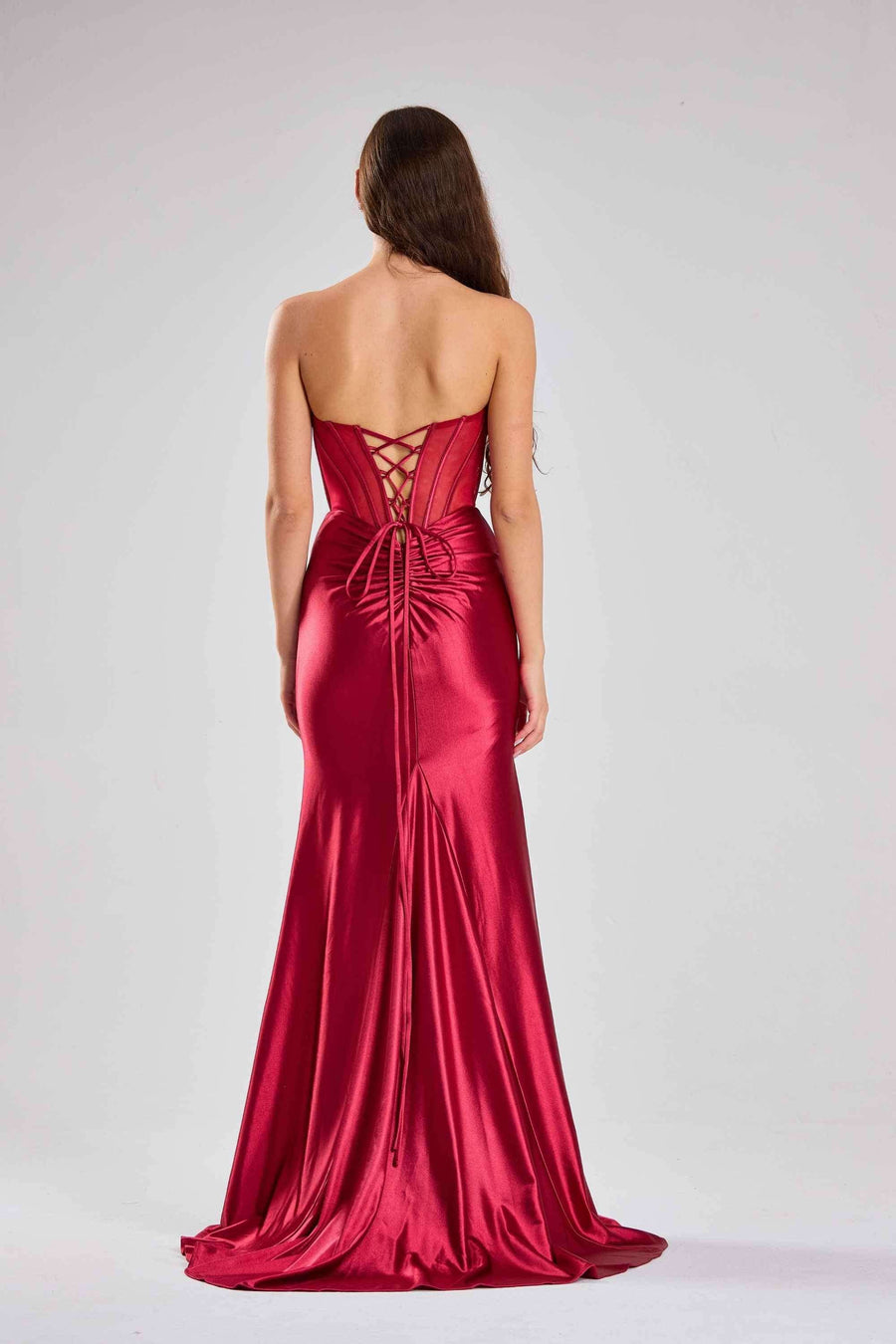 Back view of Jessica Stuart Satin Mermaid Dress in wine showing lace-up corset closure and ruched detailing, perfect for black tie galas.