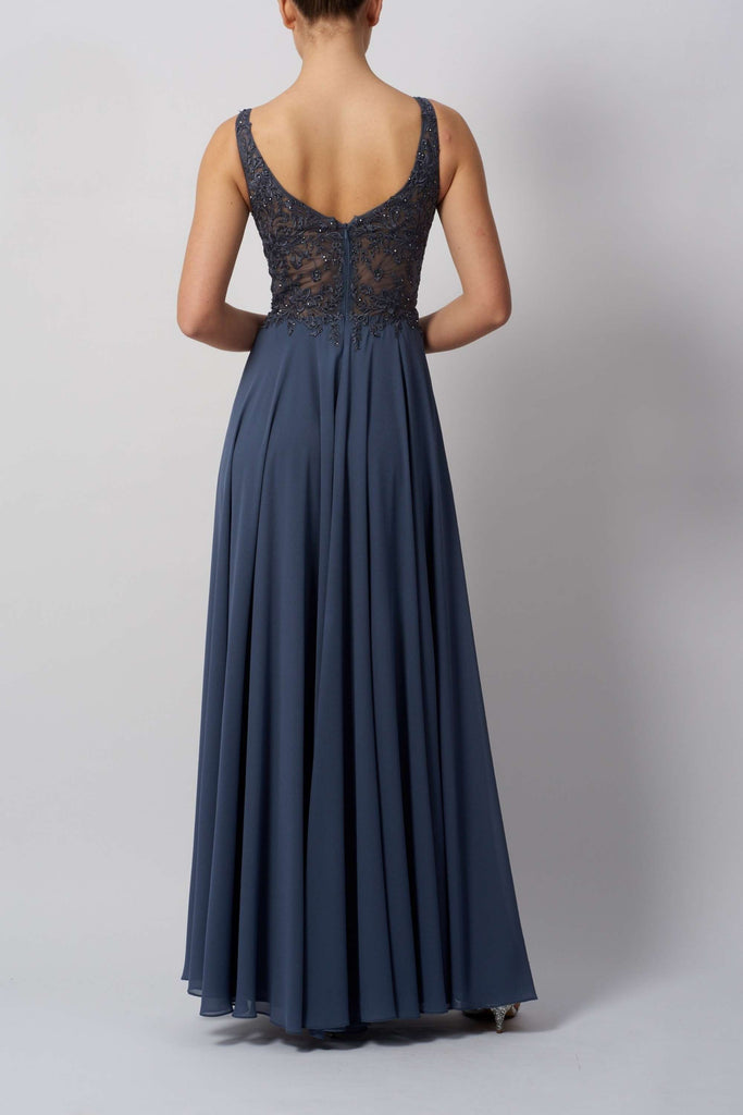 Back view of Berry Chiffon Gown in slate blue, showcasing sheer beaded bodice and flowing lightweight skirt for formal events.