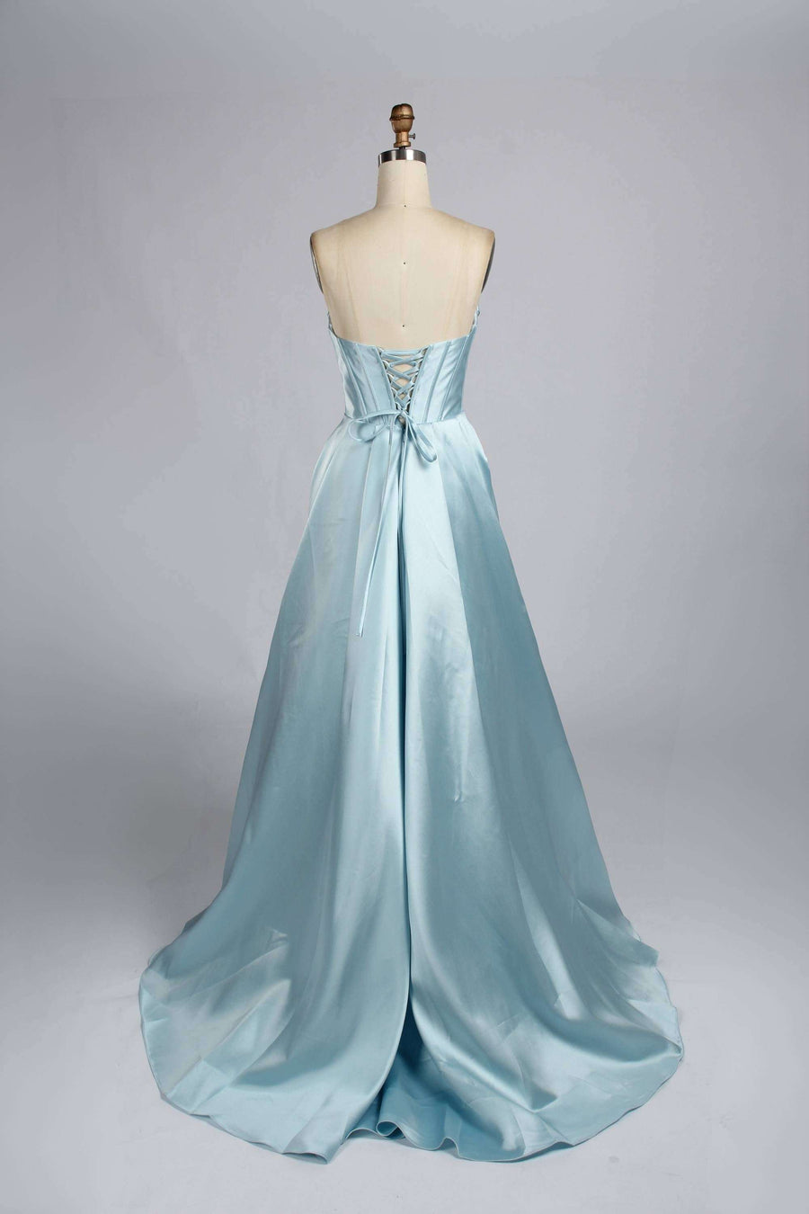 Back view of Jessica Stuart Light Blue Pearl Strapless Evening Gown 33219B featuring lace-up corset and flowing satin train for elegant occasions.