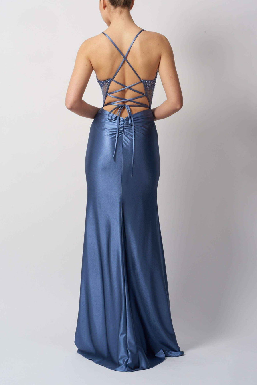 Back view of petrol tie back prom dress featuring crisscross lace-up design and ruched satin finish for a flattering silhouette.
