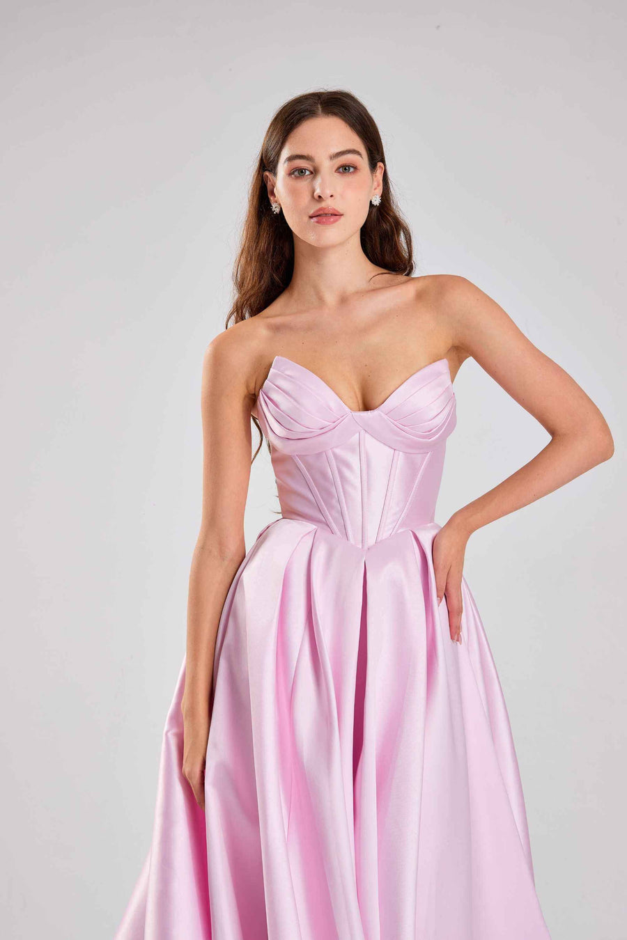 Close-up of Jessica Stuart Dress - Pink Satin Prom | Strapless, Corset bodice with ruched bustier and structured fit for elegant evening wear.