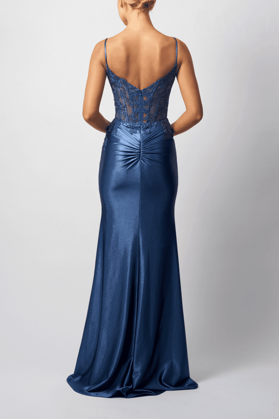 Back view of Mascara London MC119431 Airforce Blue Satin Corset Prom Dress showing low back design and ruched detailing in a sleek, long silhouette.