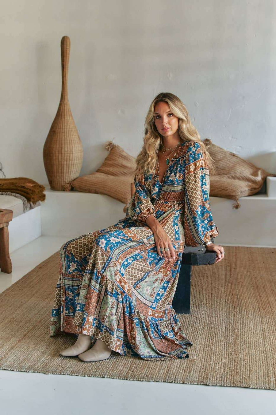 Teresa Maxi Dress - Izabelle Print in blue and brown bohemian pattern, made of 100% rayon, styled for summer elegance in a relaxed indoor setting.