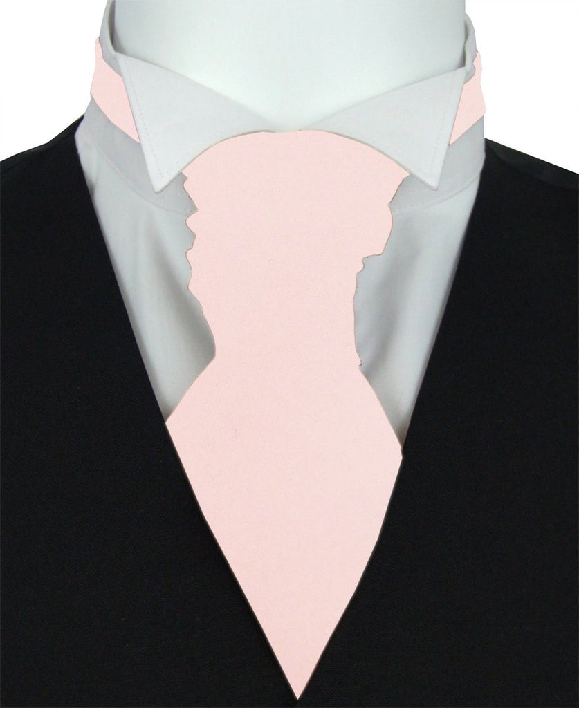 Baby Blush Wedding Cravat styled on a white shirt and black waistcoat, ideal for grooms seeking a soft pastel accent for formal attire.